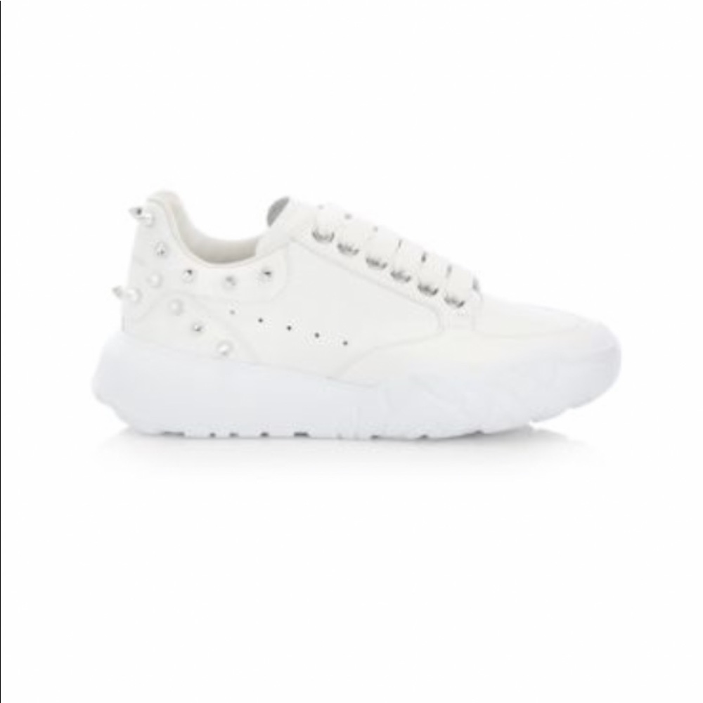 Alexander McQueen studded leather court sneakers.